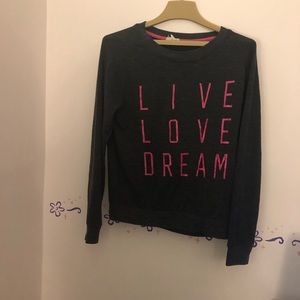Dark grey sweatshirt with pink logo